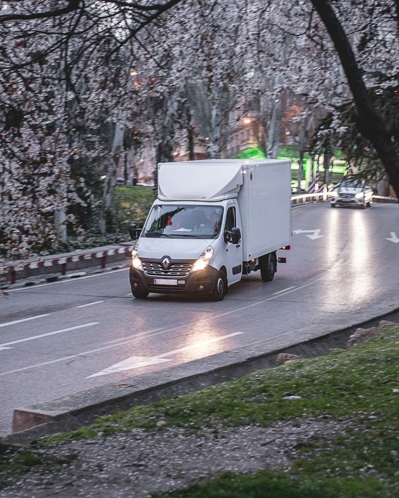 Photo by JavyGo Transporte Ferreira Camarena Toledo white van on road near trees during daytime